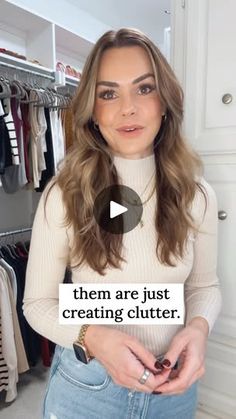 a woman standing in front of a closet with clothes on hangers and the words, them are just creating clutter