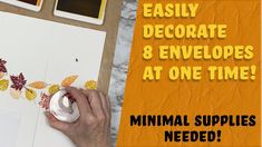 a person is painting leaves on paper with white paint and yellow lettering that says easy decorative & envelopes at one time