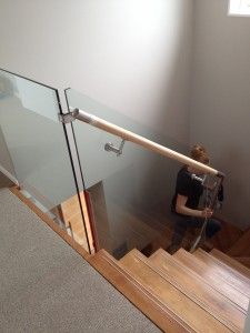 a woman is sitting on the stairs and looking down