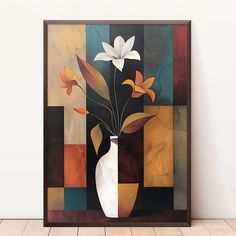 a vase with flowers in it sitting on a table next to a wall mounted painting