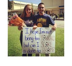 two people holding a sign that says i hope i'm not being too awkward but i can score a date to prom