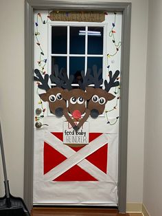 a door decorated with reindeers and a flag