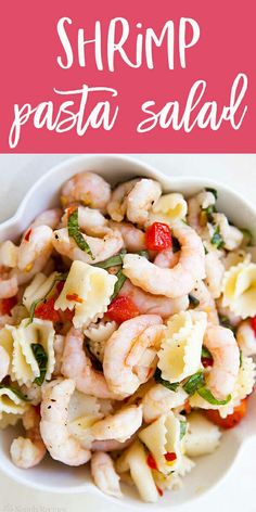 shrimp pasta salad in a white bowl on a pink and white striped tablecloth with text overlay