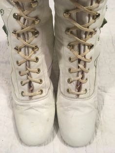 "1960s / early 70s GoGo boots white leather lace up embroidered floral detail w/tiny metal studs around the embroidery the flowers are embroidered patches and edges curl up a bit rubber heel and sole caps good vintage condition, light wear light scuffs, stains, age wear instep of right boot has a slight gap between sole and leather when worn the foot should secure this area w/it's weight could be taken to shop to secure *priced w/the possibility of that cost in mind label size 9 M, fit me true t Vintage Fitted Boots With Laces, Vintage Ankle Lace-up Boots For Spring, Vintage Leather Lace-up Boots For Spring, Vintage Lace-up Ankle Boots For Spring, Vintage Ankle Boots For Spring, Retro Lace-up Boots For Spring, Retro Lace-up Spring Boots, Retro Lace-up Fitted Boots, Vintage Spring Lace-up Ankle Boots