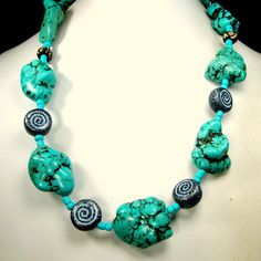 "Chunky Turquoise Stone Bead Necklace, Tribal Magnesite or Howlite w Black White Ceramic Spiral Beads, OOAk R Starr i just opened a box from my storage, all goodies set aside since My NYC shop closed decades ago. i was an importer from the mid-east and found these fabulous ceramic spiral beads in black & white beads from the 1970s and they SCREAMED at me... make me into a fabulous necklace So I did!! This dramatic big bead necklace is 20\" long ( 50.8cm ) The huge turquoise stone nuggets, ma Spiritual Blue Turquoise Necklace With Spacer Beads, Spiritual Turquoise Beaded Necklace With Spacer Beads, Polished Turquoise Beads Necklace For Festival, Unique Beaded Turquoise Necklace For Beach, Turquoise Spacer Beads Jewelry For Festival, Turquoise Gemstone Beaded Necklaces For Festival, Unique Turquoise Beaded Necklaces For Beach, Bohemian Spiral Beaded Necklace, Handmade Turquoise Spiral Jewelry