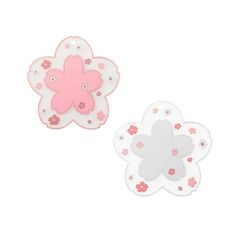 two pink and white flower shaped magnets