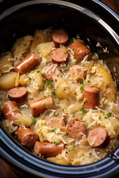 a crock pot filled with sausage and rice