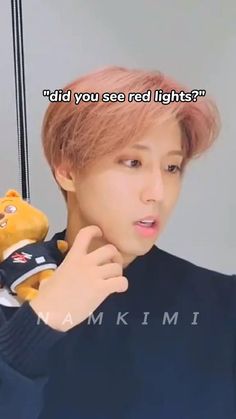 a person holding a teddy bear in front of their face with the caption did you see red lights?