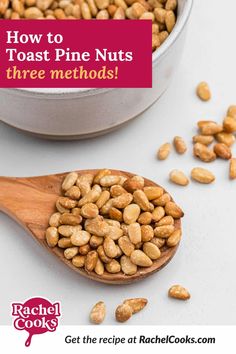 a wooden spoon filled with toasted pine nuts next to a metal bowl full of peanuts