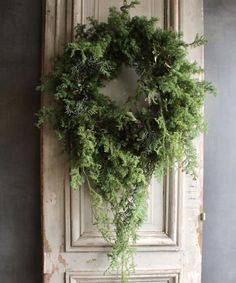 a door with a wreath hanging on it