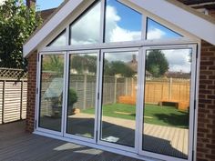 an image of a house that is being reflected in the glass windows on the outside