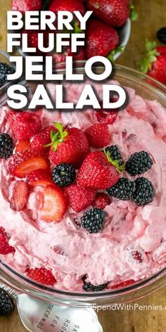 berry fluff jello salad in a glass bowl with fresh berries on the side