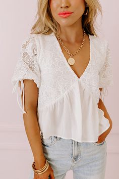 - This top is perfect for a stylish look at brunch with the girls! - Lightweight, material with crochet accents and a built-in bodice lining - A deep-v neckline - Short puff sleeves with elastic cuffs and tie accents - A ruffled under-bust - A figure flattering silhouette that ends in a subtly ruffled hemline Measurements S : Bust 32", Hip 44", Length 18", Sleeve Length 11", Waist 34". M : Bust 34", Hip 48", Length 19", Sleeve Length 11.5", Waist 36". L : Bust 38", Hip 48", Length 19", Sleeve Le Chic White V-neck Top For Day Out, Feminine V-neck Tops With Lace Sleeves, Summer V-neck Tops With Crochet Lace, Elegant V-neck Crochet Top With Lace Trim, Spring V-neck Blouse With Lace Sleeves, Feminine Lace V-neck Top, Summer V-neck Blouse With Lace Sleeves, Summer V-neck Lace Top For Brunch, White Crochet Lace Top For Brunch