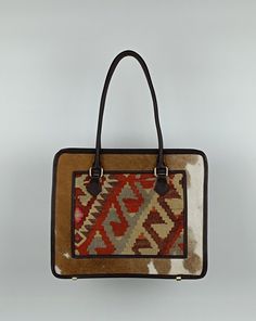 Welcome to AliDesignStore This Shoulder Bag made of one of a kind Hand-sourced vintage Turkish Kilim Rug, Cowhide with supple cow leather. Suede-like interior. Measurements ; Width:40 cm x Height:34 cm x Depth.13 cm  /   Wıdth: 15,7''x Height:13,4''x Depth:5'' İnch Handle drop height : 23cm  /  9'' inch (All mesurements are Approximate ) - Handcrafted - Materials : Vintage Turkish Kilim Rug                        one of a kind Cowhide                        Supple Cow Leather                       Brass Accessories                       Suede-like interior - Ships from a small business in Turkey Luxury Handwoven Tote Shoulder Bag, Luxury Handwoven Rectangular Shoulder Bag, Luxury Handwoven Shoulder Bag With Double Handle, Traditional Brown Satchel, Traditional Brown Rectangular Shoulder Bag, Artisan Style Handwoven Top Handle Shoulder Bag, Artisan Handwoven Top Handle Shoulder Bag, Artisan Shoulder Bag With Handwoven Top Handle, Traditional Rectangular Satchel For Everyday Use