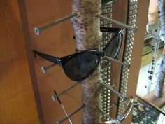 a pair of sunglasses hanging on a rack