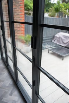 an open sliding glass door on a patio