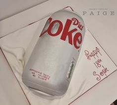 a cake made to look like a bottle of coke