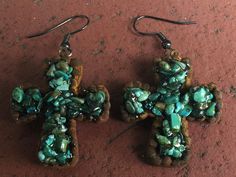 "Beautiful Maverick Rose Turquoise Cross Earrings. These earrings have a rustic look to them made by Maverick Rose of Dallas, Texas. They are made by adding resin to clay that is perfected by the artist Linda Fisher. She then added genuine turquoise chips to the drying process to create these handmade original earrings. They are for the woman that loves a statement piece of jewelry. It is also a lovely way to express your religious faith. These are vintage but never worn. * Maverick Rose earring Rustic Turquoise Earrings For Gift, Rustic Turquoise Nickel Free Earrings, Rustic Turquoise Nickel-free Earrings, Handmade Rustic Green Earrings, Rustic Handmade Green Earrings, Cowgirl Earrings, Rose Earring, Jewelry Western, Navajo Style