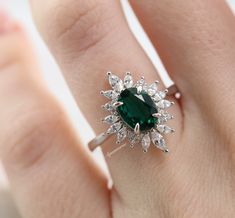 Beautiful Vintage Inspired Emerald Ring ►Made of solid sterling silver with rhodium finish (925) ►Accented with simulated diamonds (CZ) ►Average band width: 2.1 mm ►Halo size: 17.5 mm x 13.1 mm Main Stone: Emerald Gemstone Creation: genuine lab-grown Shape: Oval Gem size: 8.0 x 6.0 mm Carat Weight: 1.3 ct. (approx.) Hardness: 7.75 (Mohs scale) ✓ 100% Nickel-Free ✓ Hypoallergenic ✓ Comfort Fit ✓ Free Ring Box ✓ Free USA Shipping *All listing photos are subject to copyright. *All rights reserved. Engagement Ring On Hand, Rutilated Quartz Ring, Mohs Scale, Emerald Engagement, Vermeil Jewelry, Silver Engagement Rings, Solid Gold Jewelry, Emerald Engagement Ring, Birthday Gift For Her