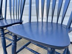 two blue chairs sitting next to each other