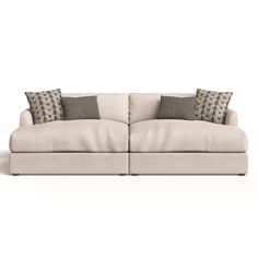 a couch with two pillows on it and one arm folded back to the other side