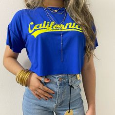 Blue California Crop Tee | True To Size S M L Check Out Our Ig: @V.Boutiquepr Trendy Blue Summer Tops, Blue Short Sleeve Top With Letter Print, Trendy Light Blue Top With Letter Print, Blue Cotton Graphic Print Crop Top, Blue Cotton Crop Top With Graphic Print, Blue Crew Neck Crop Top In Trendy Style, Summer Blue Crop Top With Graphic Print, Blue Graphic Print Crop Top For Summer, Blue Graphic Print Crop Top For Spring