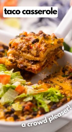 a bowl filled with taco casserole sitting on top of a table