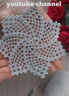 someone is holding a crochet doily with the words youtubetube channel on it