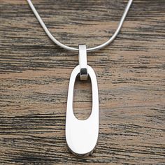 Artisan Alon Diller is greatly inspired by contemporary artwork. He translates that inspiration into this silver pendant choker, which features a bold, abstract design for a striking look. Contemporary Pendant Jewelry, Modern Jewelry With Large Rectangular Pendant, Contemporary Sterling Silver Necklace With Large Pendant, Modern Rectangular Pendant Jewelry With Polished Finish, Modern Sterling Silver Rectangular Pendant Jewelry, Modern Sterling Silver Oval Pendant Jewelry, Modern Sterling Silver Jewelry With Rectangular Pendant, Modern Teardrop Pendant Necklace, Modern Silver Pendant Necklace