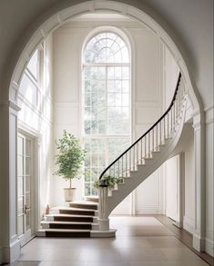 a staircase leading up to a large window