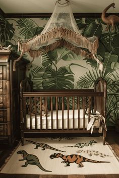 a baby's room decorated with dinosaur wallpaper