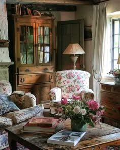 a living room filled with furniture and flowers