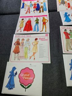 four vintage sewing patterns are laid out on the floor