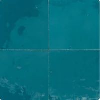 an image of the earth as seen from space in four different shades of teal