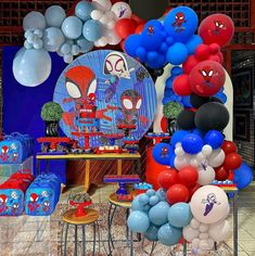 spiderman themed birthday party with balloons and decorations