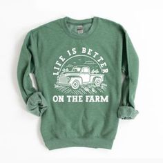 This trendy Gildan unisex graphic sweatshirt from Simply Sage Market is sure to make a great addition to any wardrobe. These sweatshirts are a relaxed unisex fit, please refer to the size chart. Sweatshirt Farm Trucks, Heather Green, Tractor Supply, Clothing Inspiration, On The Farm, The Farm, Tractor, Sweatshirts Women, Life Is Good