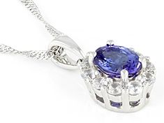 1.25ct Oval Tanzanite With 0.85ctw Round White Zircon Rhodium Over Sterling Silver Pendant With 18"Singapore Chain. Measures Approximately 0.74"L x 0.37"W. 2.5mm bail. Lobster clasp with 2"extender. Accent stones primarily zircon. Oval White Gold Necklace With Center Stone, Silver Oval Gemstones With Brilliant Cut, Oval Silver Gemstones With Brilliant Cut, Tanzanite Gemstone, Blue Tanzanite, Pendant With Chain, Faceted Gemstones, 1 Carat, Cultured Pearls