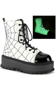 Boots perfect for your favourite venomous vixen. The SLACKER series from Demonia features an ultra-comfy platform sole and feisty rave festival flair. Vegan White Glow in the Dark Upper Contrasting patent toe & tongue 2-inch platform Inner zip Spiderweb embroidery Lace Up Ankle length U.S womens sizing - refer to s Demonia Boots, Alternative Shoes, Demonia Shoes, Dr Shoes, Web Detail, Light Up Shoes, Platform Ankle Boots, Outfits Winter, Lace Up Ankle Boots