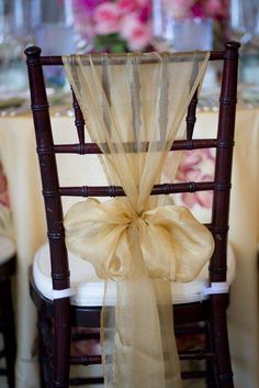 a chair with a bow tied to it