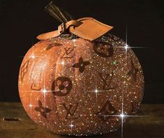 an orange pumpkin decorated with numbers and stars