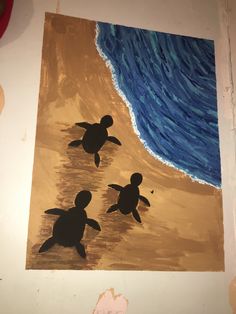 a painting of two turtles on the beach