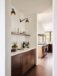 the kitchen is clean and ready to be used as a wine bar or dining room