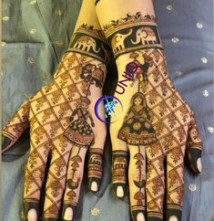 the hands and feet of a woman with henna designs on their palms, both decorated with elephants