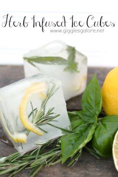 two lemons and some leaves on a table next to ice cubes with herbs