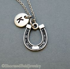 "❖ Horseshoe charm Antique Silver Pewter. Approx:11/16\" X 9/16\" Lead free pewter charm made in U.S.A. ❖ Hand Stamped Initial Charm - Antique Silver Pewter 3/8\" (9mm) ❖ Click below for Horseshoe necklace in antique gold pewter: https://www.etsy.com/listing/167327485 ❖ Add a birthstone or Freshwater pearl for $3.50 https://www.etsy.com/listing/110444872 ❖ Additional Hand Stamped Initial Charms $4.50 each: https://www.etsy.com/listing/107021419 ❖ Go back to Short and Bald Jewelry http://www.etsy Personalized Silver Horseshoe Jewelry, Country Girl Jewelry, Silver Initial Necklace, Horseshoe Necklace, Cowgirl Jewelry, Horse Jewelry, Necklace Initial, Western Jewelry, Personalized Monogram