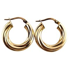 14 Karat Yellow Gold Twisted Hoop Earrings This beautiful set of twisted hoops were meticulously crafted from 14K yellow gold! Diameter: 18.17mm Width: 3.9mm Weight: 1.48 dwt/ 2.29 g Hallmark: Italy *1 AR 14K Very good condition, professionally polished. Will come packaged in a gift box or pouch (when possible) and will be shipped U.S. Priority Mail Insured. MM09062417KC Twisted Hoop Earrings, Jewelry Earrings Hoops, Estate Jewelry, Priority Mail, Silver Gold, Gift Box, Jewelry Earrings, Hoop Earrings, Yellow Gold