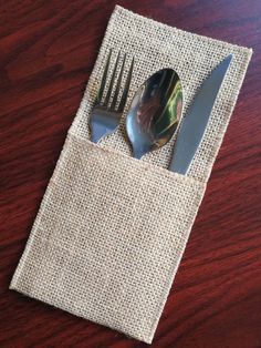 two forks and spoons in a pocket on a table