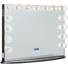 an illuminated vanity mirror with lights on it