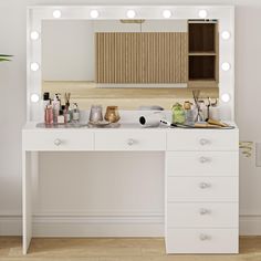 a white vanity with lights on it in front of a mirror