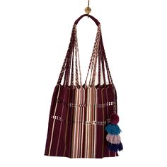 We have brought the quintessential Mexican striped hammock bag with pom pom home with us in an array of enticing colors. The woven yarns in the purse are braided to become the straps that lead up to a comfortable finished shoulder strap. This is the purse that your friends will be asking where you got it! Hand selected and imported from Guanajuato, Mexico. Entirely handwoven on traditional Maya looms, it takes an artisan an entire days worth of weaving to complete one striped hammock bag. • Doub Pom Pom Fashion, Hammock Bag, Black Candy, Striped Bags, Candy Stripes, Market Bag, Got It, Black And Tan, Hammock